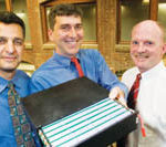 Laptop cell charges up business PBN Staff photo/Stephanie Ewens
Battery Mates: Modular Energy Devices executives show off their lithium-ion battery. From left are Farshid Bakhtyari, vice president of engineering; Stephen Eaves, battery inventor; and Mark Dingley, business development director.