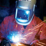 Industrial artists show their mettle PBN Staff photo/Stephanie Ewens
COMMUNITY INVOLVEMENT is key at the Steel Yard. Above, Celeste S. Thomason welds metal pieces for a community art project being installed by artist Gillian Christy.