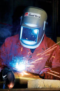 PBN Staff photo/Stephanie Ewens
<b>COMMUNITY INVOLVEMENT</b> is key at the Steel Yard. Above, Celeste S. Thomason welds metal pieces for a community art project being installed by artist Gillian Christy. PBN Staff photo/Stephanie Ewens<br><br>
<b>COMMUNITY INVOLVEMENT</b> is key at the Steel Yard. Above, Celeste S. Thomason welds metal pieces for a community art project being installed by artist Gillian Christy.