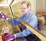 PBN Staff photo/Stephanie Ewens
Tom Webster of Brown University feeds cells, a process that involves taking off old culture medium and adding new medium.