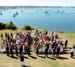 PHOTO COURTESY THE SULLIVAN HOUSEA COUPLE exchanges vows on the lawn of The Sullivan House on Block Island, which hosts at least 20 weddings per year, many involving New York brides.