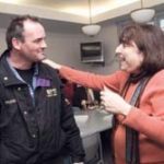 MARCIA B. REBACK, president of the Rhode Island Federation of Teachers and Health Professionals, speaks with Frank Casey of the Northern Rhode Island Collaborative union during their monthly executive council meeting. / 