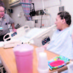 A Ritz-ier approach to patient care JIM BOLSTER, a mechanic at The Miriam Hospital, works on fixing the railing of patient Theresa Gaffney's bed. Bolster says a new customer service course taught him what a difference he can make for patients. /