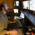 MICHAEL DAWSON, director of post production at Tango Pix, demonstrates the 'Action Blast' movie the company produced for Hasbro Inc. / 