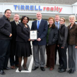 MILLIE WRIGHT, third from left, loan officer for Rhode Island Housing, with, from left, Gil Medeiros, Skip Gilmore, Phil Tirrell, Jennifer Feighery, Bill Tirrell, Stephanie Duggan and Louanne Jennings, all of Tirrell Realty. / 