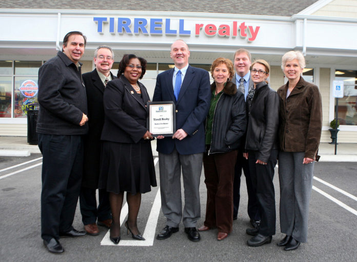 MILLIE WRIGHT, third from left, loan officer for Rhode Island Housing, with, from left, Gil Medeiros, Skip Gilmore, Phil Tirrell, Jennifer Feighery, Bill Tirrell, Stephanie Duggan and Louanne Jennings, all of Tirrell Realty. / 