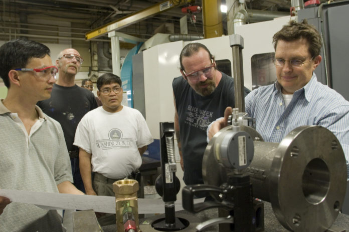 ON-THE-JOB-TRAINING: Taco Inc. and the Community College of Rhode Island team up to provide training for the company's workers last spring. / ON-THE-JOB-TRAINING: Taco Inc. and the Community College of Rhode Island team up to provide training for the company's workers last spring. /