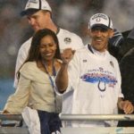 INDIANA COLTS head coach Tony Dungy celebrates his team's 29-17 Superbowl win with wife Lauren, left, and quarterback Peyton Manning.  / 