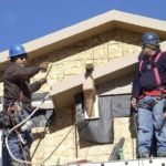 Fed, OCC under fire in mortgage meltdown BUILDERS work on a new house in Denver. /