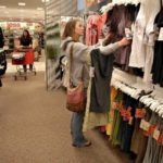 WARMER WEATHER has boosted shopping for spring clothes, the ICSC said today in its report for the week ended March 24. Above, Bridge Balthaser, 20, shops earlier this month at a Super Target store in Littleton, Colo.  / 