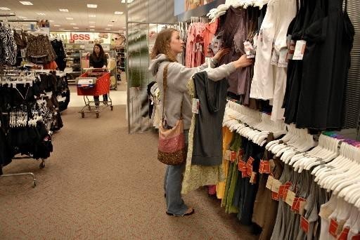 WARMER WEATHER has boosted shopping for spring clothes, the ICSC said today in its report for the week ended March 24. Above, Bridge Balthaser, 20, shops earlier this month at a Super Target store in Littleton, Colo. / WARMER WEATHER has boosted shopping for spring clothes, the ICSC said today in its report for the week ended March 24. Above, Bridge Balthaser, 20, shops earlier this month at a Super Target store in Littleton, Colo. /