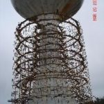 THE TECHNOLOGY PARK Water Storage Tank is surrounded by scaffolding this month as workers  prepare to sandblast and recoat the exterior. It's part of a $729,504 refurbishment by Rockwood Corp. of Lyons Falls, N.Y., due to be completed by June. / 