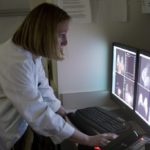 Local doctors helping set new standards<br> for breast cancer diagnosis DR. ELIZABETH LAZARUS, a radiologist at Women & Infants Hospital, looks at an MRI of breasts scanned with new technology where the patient lies on her stomach. /