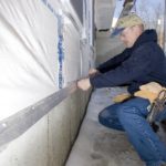 Paying a price for their service RICHARD DUMONT, owner of R.N.D. Builders in Seekonk, had to drop everything to serve a year-long tour in Iraq with the R.I. Army National Guard. Above, he works on a house his company is building in Cumberland. /