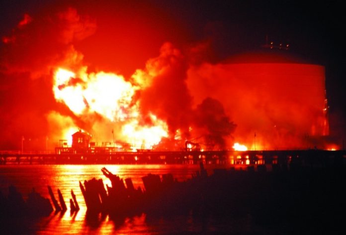 THE QUICK ACTION of firefighters kept the July 18 fire, at a fuel terminal  in the Port of Providence, from spreading beyond the Motiva dock to the nearby storage tanks.  / 