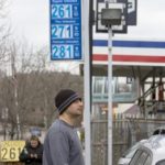 AT A GAS STATION in Newton, Mass., last month, an attendant fuels a customer's car. / 