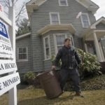 Mass. home sales continue to slide CURB APPEAL: A landscaper tidies up last month at a house for sale in Newton, Mass. /
