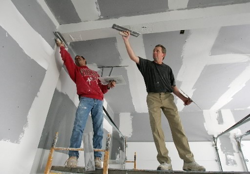 IN THE NORTHEAST, new-home sales last month rose 50%, to 18% above their level in March 2006. Above, workers smooth the ceiling of a new house in Smithfield. / IN THE NORTHEAST, new-home sales last month rose 50%, to 18% above their level in March 2006. Above, workers smooth the ceiling of a new house in Smithfield. /