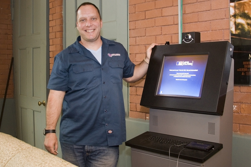 DANA PAUL of Shazamm, with one of the kiosks for which the company created software that allows companies to operate the kiosks easily and remotely. / 