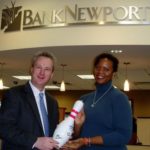 BankNewport employees raise $2K for local group BOWL-A-THON coordinator and BankNewport mortgage loan originator Daniel M. Silverman, left, and and Amand Frye Leihhos, executive director of The Dr. Martin Luther King Jr. Community Center, pose with the winning team's autographed bowling pin trophy. /