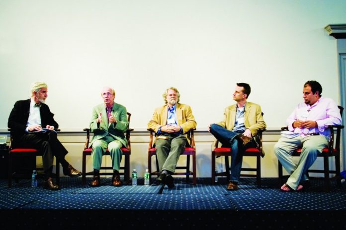 MODERATOR Christopher Lydon, left, and panelists Michael Lysaght of Brown, Philip Long of MIT, IT consultant Jack Templin and Seth Goldenberg of RISD, discuss the impact of fast-changing technology on society and the economy. / 