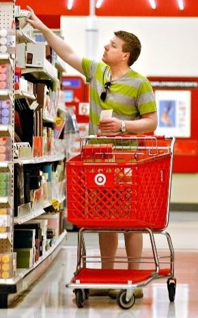 TARGET CORP. beat expectations with an April sales decline of 6.1 percent as last month's chilly weather, high gas prices and early Easter left retailers reeling. Above, Thad Radel shops yesterday at a Target store in St. Louis Park, Minn. / TARGET CORP. beat expectations with an April sales decline of 6.1 percent as last month's chilly weather, high gas prices and early Easter left retailers reeling. Above, Thad Radel shops yesterday at a Target store in St. Louis Park, Minn. /