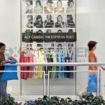 SUNNY WEATHER and Mother's Day (May 14) gave U.S. retail sales a boost last week, according to the ICSC-UBS report. Above, a woman walks past an Express in New York last Friday as another women pauses to talk on her cell phone.  / 