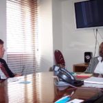 JOHN GROSVENOR, left, CEO of Newport Collaborative, speaks yesterday with David Johnson, deputy minister of The Bahamas Ministry of Tourism, exploring the possibility of development and historic preservation projects in Nassau. / 