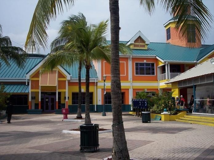 THIS WELCOME BUILDING greets cruise ship passengers arriving in Nassau. Its broad porch, metal roof and bright colors are typical of Bahamian architecture. / 