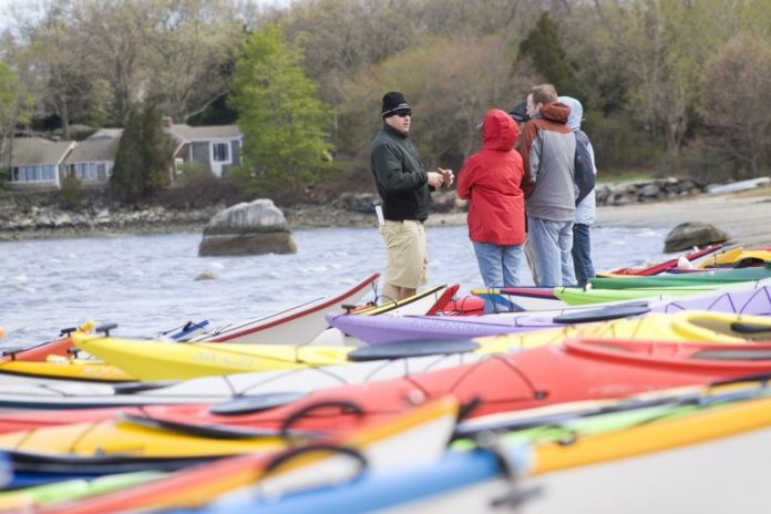 PADDLEFEST-GOERS bundle up against the breeze from Wickford Harbor. / PADDLEFEST-GOERS bundle up against the breeze from Wickford Harbor. /