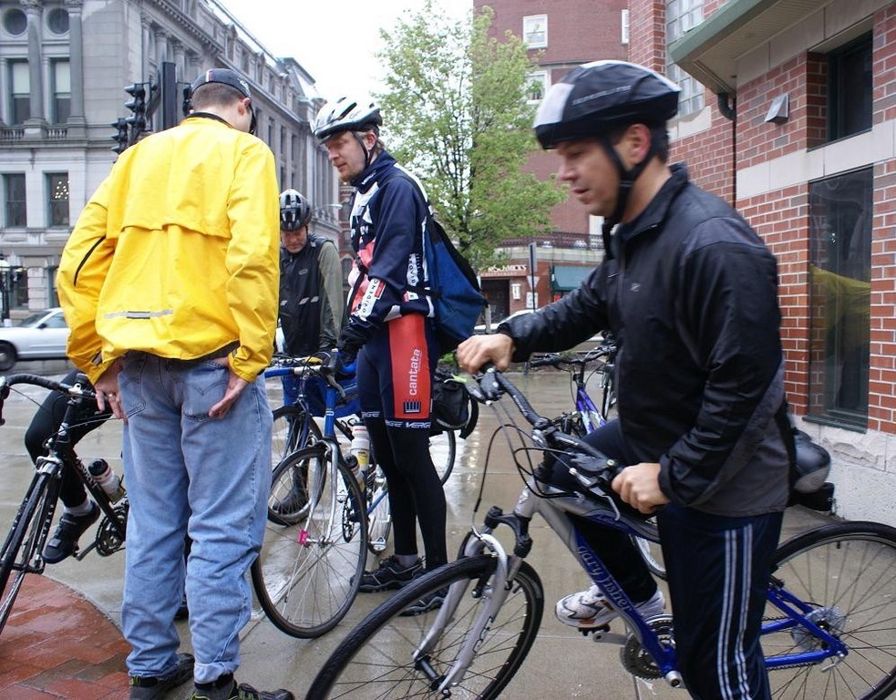 MAYOR DAVID N. CICILLINE, right, and other city commuters brave the rain this morning in Providence to participate in Bike to Work Day. The annual RIDOT event promotes bicycling as a healthful means of reducing energy use, pollution and rush-hour traffic.  / 