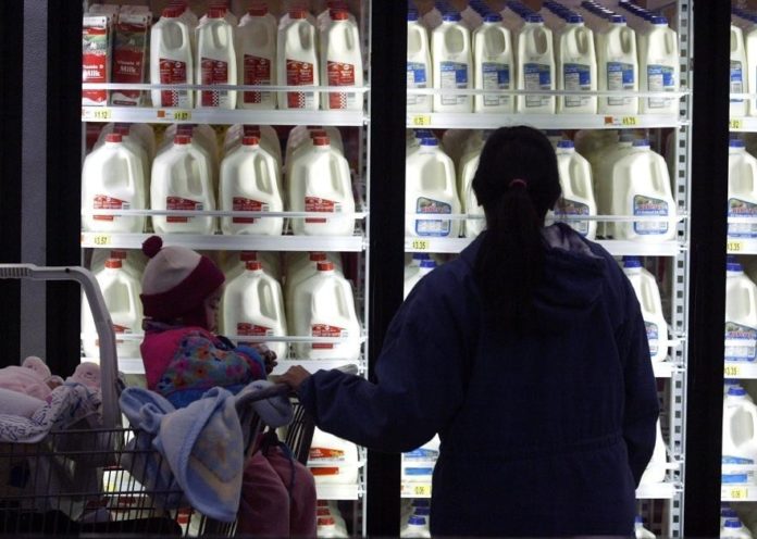 WAL-MART has been making its stores more energy-efficient to improve its bottom line. Above, a store in Kansas City, Mo., where the cases have LED lighting. / 