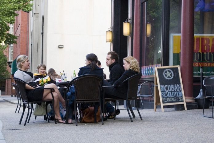 FRIENDS ENJOY al fresco dining at Cuban Revolution in downtown Providence. The restaurant was the first in the city to be granted an outdoor permit this year. / FRIENDS ENJOY al fresco dining at Cuban Revolution in downtown Providence. The restaurant was the first in the city to be granted an outdoor permit this year. /