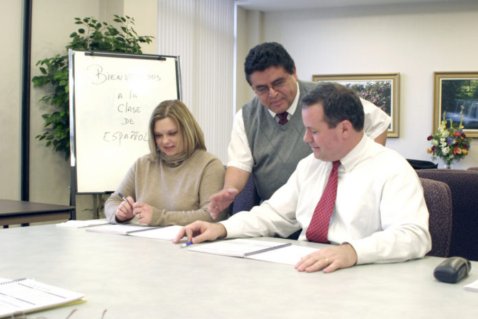 CCRI'S WORKPLACE SPANISH program participants from Navigant Credit Union, from left, are: Danielle Rossignol, member service representative; course instructor Marco Enriquez; and Timothy Draper, VP of marketing. / CCRI'S WORKPLACE SPANISH program participants from Navigant Credit Union, from left, are: Danielle Rossignol, member service representative; course instructor Marco Enriquez; and Timothy Draper, VP of marketing. /