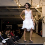 AT RUNWAY EARTH, an April 26th fashion show at the ALCO complex, Brown University freshman Shruti Prekh walks down the runway in her made-from-shopping-bags dress, entitled 'Thank You for Shopping.' / 
