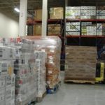 Donation helps R.I. Food Bank<br> through high-need months ROBBY TAYLOR of the Rhode Island Community Food Bank unloads a truckload of food donated by Ocean State Job Lot. The donation will help feed thousands of people across the state during the high-need summer months. /