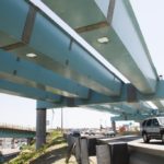 TRAFFIC zips along last week beneath the ramps being constructed to link I-95 to the new I-195 as part of the Iway project. / 