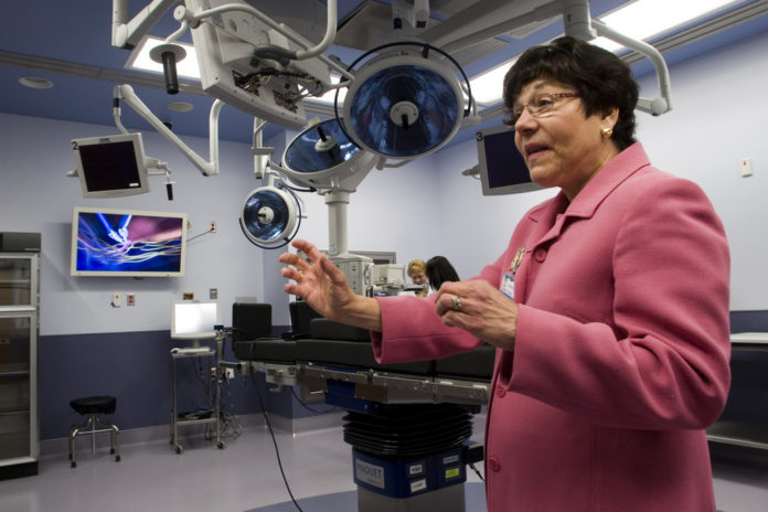 BRAND NEW DIGS: Kathleen Hittner, president and CEO of The Miriam Hospital, leads a tour last week of the new inpatient and surgical services center set to open today. / BRAND NEW DIGS: Kathleen Hittner, president and CEO of The Miriam Hospital, leads a tour last week of the new inpatient and surgical services center set to open today. /