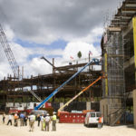 Fidelity builds ‘a record-setter’ A STEEL BEAM, signed by the workers who are erecting Fidelity Investments' $200 million new office building in Smithfield, sits on a still-unfinished portion of the building after the topping-off ceremony on June 22. When completed, the 577,000-square-foot structure will be the largest office building in the state. /