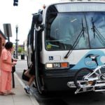 DOWNTOWN OFFICE WORKERS board a RIPTA bus at the end of the business day. Few companies offer employee incentives for using public transit, officials say, and those who do find few takers. / 