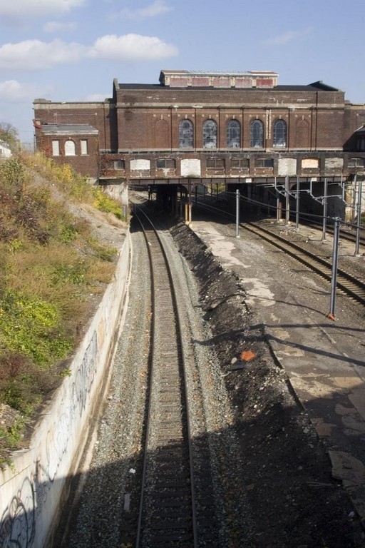 THE DEPOT, as townspeople call the former Pawtucket/Central Falls Station, straddles the railway line and the city line. The curve in the tracks makes it less desirable as a new commuter rail station, a study found. / THE DEPOT, as townspeople call the former Pawtucket/Central Falls Station, straddles the railway line and the city line. The curve in the tracks makes it less desirable as a new commuter rail station, a study found. /