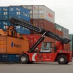 Containers are moved at the Port of Portland in Portland, Ore. U.S. exports set a record in May, as a weak dollar and strong overseas economies created demand for U.S. goods. / 