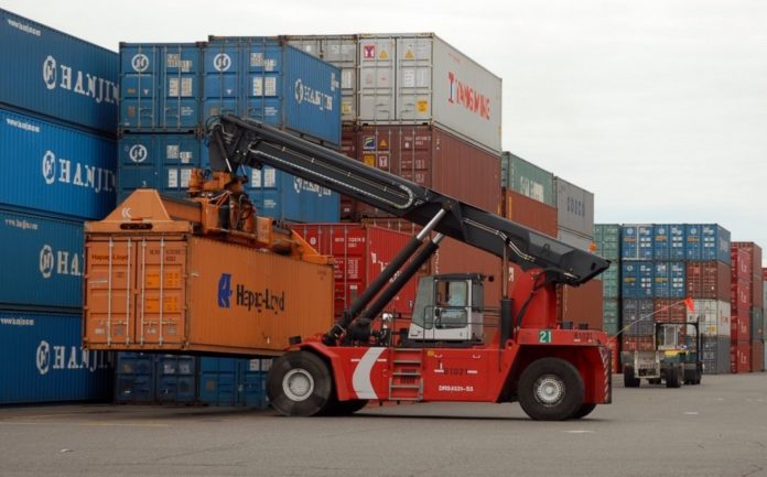 Containers are moved at the Port of Portland in Portland, Ore. U.S. exports set a record in May, as a weak dollar and strong overseas economies created demand for U.S. goods. / Containers are moved at the Port of Portland in Portland, Ore. U.S. exports set a record in May, as a weak dollar and strong overseas economies created demand for U.S. goods. /
