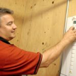 R.I. company reducing energy use Dryvitt Plant Manager Gary Ridenour points out the new electrical system that the company is putting into place to help reduce electricity consumption. With the help of National Grid they have reduced consumption by almost 40 percent. /