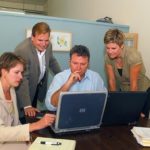 Tech firm capitalizes on banking mergers WHYDATA TEAM MEMBERS, from left, Mary Curtis, Keith Authelet, Peter Gray and Heather Gutshall work together on a project. /