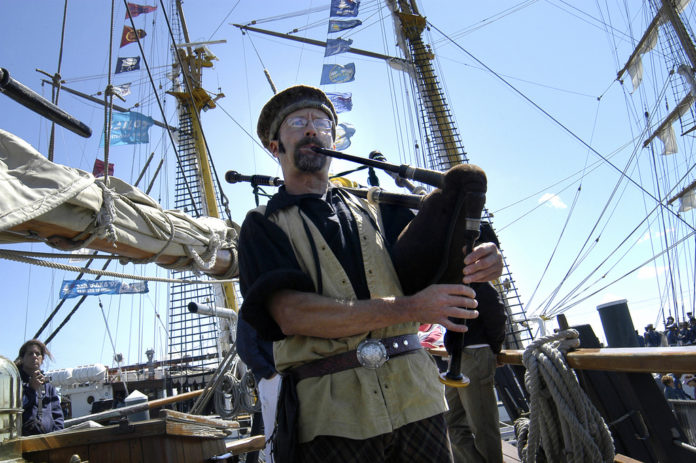 CHARLIE RAFERTY  plays the bagpipe aboard the 65-foot Continental Sloop Providence, a replica of the first vessel commanded by John Paul Jones during the Revolutionary War. / 