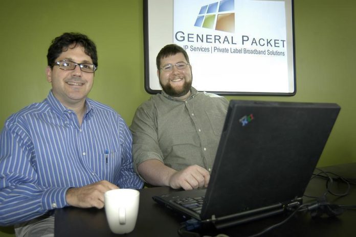 DENNIS DIBATTISTA, left, president, and Edward McConnell, director of applications development, at General Packet, a small tech firm in Pawtucket that specializes in IP services and private-label broadband services for businesses. / 