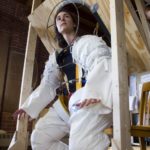RHODE ISLAND SCHOOL OF DESIGN student Jen Harris  sits in a space suit created as part of a project sponsored by NASA  to find ways to better seal a space craft to keep moon dust out. / 
