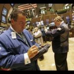 TRADERS ARE BUSY on the floor of the New York Stock Exchange as equities extend a rally that started Monday. / 