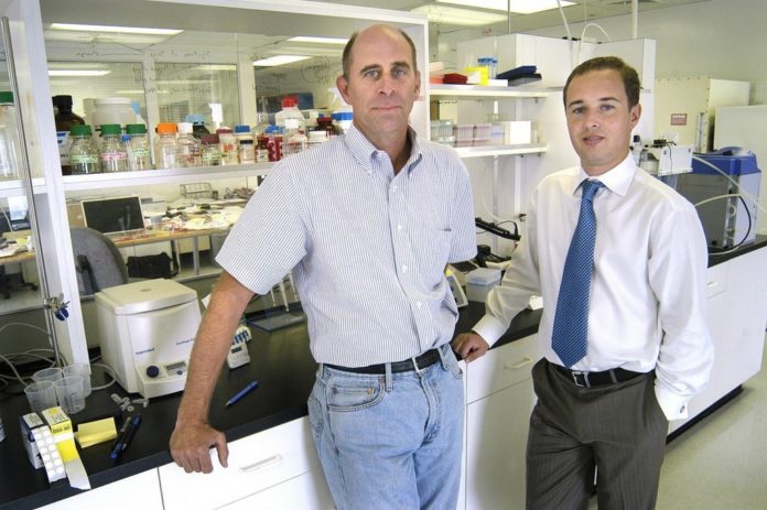 JOHN OLIVER, left, vice president of R&D at NABsys, has been awarded a federal grant for his genome sequencing work. At right is NABsys President and CEO Barrett Bready. / JOHN OLIVER, left, vice president of R&D at NABsys, has been awarded a federal grant for his genome sequencing work. At right is NABsys President and CEO Barrett Bready. /